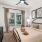 Well-lit bedroom with ceiling fan